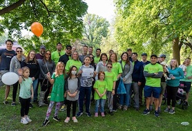 Children and Amway volunteers pose together after raising money to support Easter Seals.